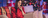 women sitting on the couch on her laptop with Christmas a tree and presents in the back ground